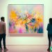 A man and woman looking at a piece of art in a fine art gallery.