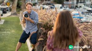 Photographer Christopher Todd taking a photo of a female subject.